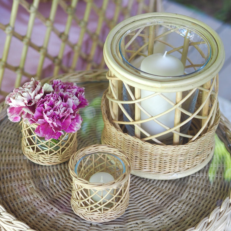 Belanak Wicker Hurricane Large. These wicker hurricanes can be used in multiple ways. Group the two different sizes with candles on the dinner or side table or alternatively use them as vases with fresh flowers.  The glass insert can be removed for easy cleaning in the dishwasher. Made by hand of woven rattan by our artisans in Java, Indonesia.  